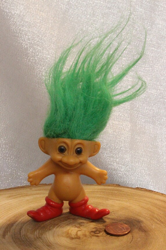 toy trolls with colored hair