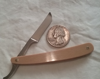 Vintage miniature straight edge.