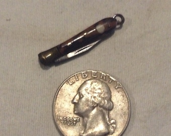 Tiny base ball knife