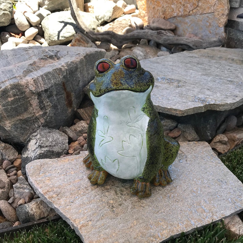 concrete frog statue