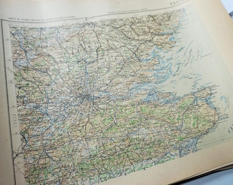 May include: A vintage map of France, showing the region around Paris. The map is printed in black and white on a cream-colored paper. The map is titled "Carte de France Detaillee au 1/200,000"
