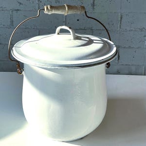 May include: A set of three ceramic mugs with a speckled, matte finish. The mugs are in shades of cream, light gray, and dark gray. Each mug has a simple, minimalist design, perfect for coffee or tea.