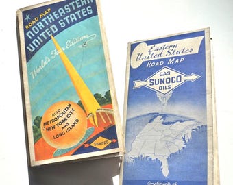 May include: Two vintage road maps from the 1930s or 1940s. The map on the left is for Northeastern United States and features a yellow tower with the text "World's Fair Edition". The map on the right is for Eastern United States and features a blue and white map of the eastern United States with the text "Gas Sunoco Oils" and "Compliments of Your Sunoco Dealer".