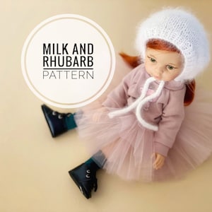 May include: A doll wearing a white knit bonnet, a pink hoodie, and a pink tulle skirt. The doll is also wearing black boots with teal accents. The image includes the text "MILK AND RHUBARB PATTERN" in a circular design.