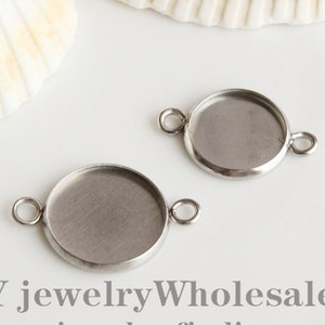 May include: Two silver-toned metal bezel settings with jump rings. The bezels are round and have a smooth, polished finish. DIY jewelry wholesale jewelry findings supplies.