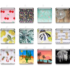 May include: Twelve square glass tiles with different colorful patterns. The patterns include cherries, arrows, leaves, pineapples, lemons, flamingos, cacti, and a moon.