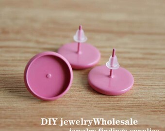 May include: Three pink round earring bases with silver posts and clear rubber earring backs. DIY jewelry wholesale jewelry findings supplies.