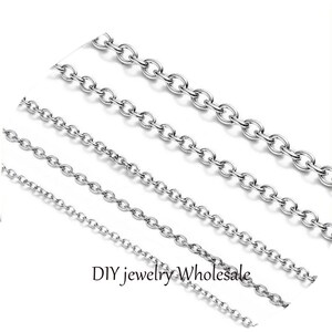May include: Four silver chain necklaces of varying lengths and thicknesses.  DIY jewellery wholesale.