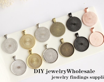 May include: Assortment of 10 round metal pendant trays in various finishes, including silver, gold, bronze, black, and rose gold. The trays have a textured, circular design and are perfect for adding a custom touch to jewelry projects.