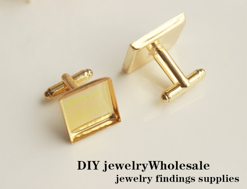 May include: Two gold-toned cufflinks with square glass inserts. The cufflinks are designed for DIY jewelry making.