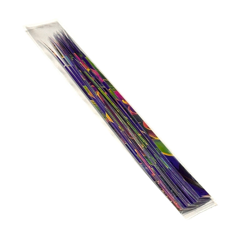 May include: A bundle of colorful, patterned paper straws in a clear plastic sleeve. The straws are arranged in a fan shape and have a variety of colors, including purple, green, yellow, and pink.