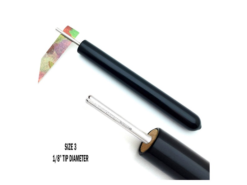 Paper Bead Roller Quilling Tool with 1/8 inch diameter Slotted Tip and black vinyl covered handle. Paper roller has strip of paper in tip.