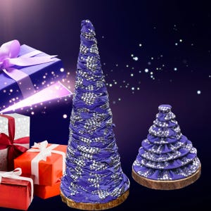May include: Two decorative Christmas trees made of blue fabric with silver accents, set on wooden bases. A tall, conical tree stands next to a smaller, tiered tree. Several wrapped gift boxes in red, white, and purple are in the background.