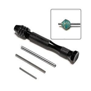 May include: A black hand drill with a chuck and three metal mandrels. The drill is used for holding and rotating small objects, such as beads, for crafting and jewelry making.