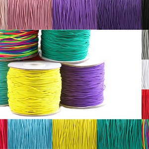 May include: Assortment of colorful elastic cord spools in various colors, including rainbow, turquoise, yellow, green, purple, pink, gray, white, black, and red.