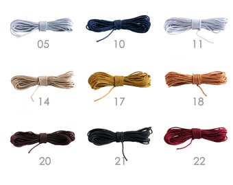 May include: Assortment of 10 spools of cord in various colours, including light blue, navy blue, white, beige, gold, orange, brown, black, and burgundy. Each spool is labelled with a number from 05 to 22.