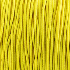 May include: Close-up of a spool of bright yellow elastic cord. The cord is tightly wound and has a smooth, consistent texture.