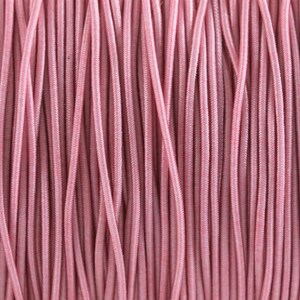 May include: Close-up of a spool of pink elastic cord. The cord is tightly wound and has a smooth, shiny finish.
