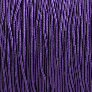 May include: A close-up of a spool of purple elastic cord. The cord is tightly wound and has a smooth, even texture.