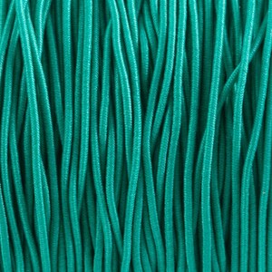 May include: Close-up of a bundle of teal-colored paracord.