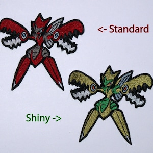May include: Two embroidered iron-on patches of a Pokemon character. The character is a red and grey robot with large claws. The second patch is a green and gold version of the same robot. The text "<- Standard" is above the red and grey patch and "Shiny ->" is below the green and gold patch.