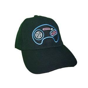 Neon Genesis Controller Hat - Black Hat with shiny metallic embroidered patch attached.