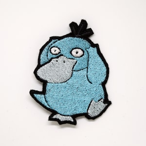 Glänsande Psyduck - Stryk-på-lapp - Metalliskt broderad. Pokémon-lapp.