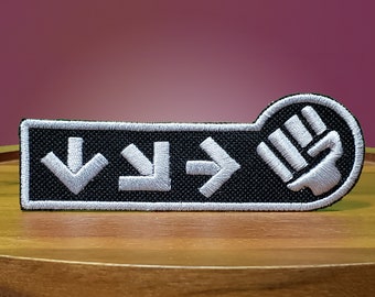 Perforatrice vers le bas - écusson thermocollant pour broderie métallique brillante.