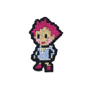 May include: Embroidered patch of a pixelated cartoon character with pink hair, a light blue shirt, and red shoes.