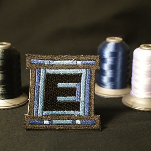 Pixel art Mega Man E Tank Shiny Metallic Embroidery Iron On patch.