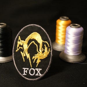 FOX Shiny Metallic Embroidery patch. Metal gear solid iron on patch.