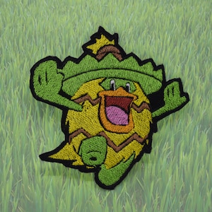 Ludicolo - Strykmärke - Glänsande metalliskt broderat. Pokémon-märke.