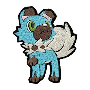 May include: A blue and brown embroidered patch of a cartoon dog with a white fluffy tail. The dog has a brown nose and green eyes.