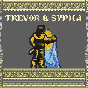 May include: Embroidered patch featuring pixelated figures embracing, with the text "TREVOR & SYPHA" above. The figures are in black and gold, with a blue cape. The background is gray, with decorative pixelated borders.