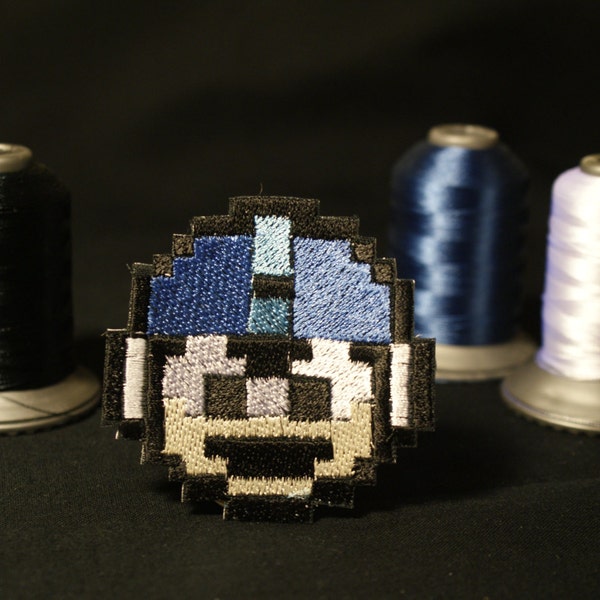 Parche termoadhesivo bordado metálico brillante de Pixel art Mega Man Extra life.