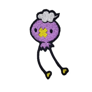 May include: Purple embroidered patch of a cartoon bird with a yellow beak and white cloud on its head.