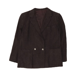 May include: A dark brown double-breasted blazer featuring a notched lapel, two front patch pockets, and two buttons at the centre closure. The garment is constructed from a textured fabric and includes a dark brown interior lining visible at the collar.