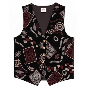 May include: A black vest featuring a repeating pattern of maroon and white geometric shapes, including rectangles, circles, and wavy lines. The garment has a V-neckline, a dark interior lining, and four gold-toned buttons down the center front.