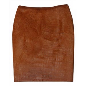 May include: A knee-length skirt in a rich, warm brown hue featuring a textured, embossed pattern that mimics the appearance of reptile skin. The garment has a straight, structured silhouette with a clean, waistband-free top edge design.