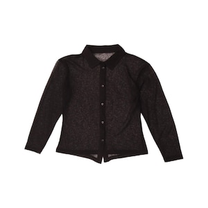 May include: A long-sleeved button-down shirt in a dark charcoal grey colour with a subtle heathered texture. The garment features a classic pointed collar, a vertical front placket with matching dark buttons, and a straight hemline at the bottom.