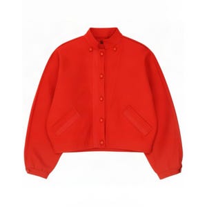 May include: A bright red cropped jacket featuring a high collar, long sleeves with buttoned cuffs, and a front placket with matching red buttons. The garment includes two slanted welt pockets on the front and a structured, clean-lined design.