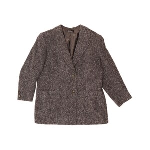 May include: A brown and grey speckled tweed blazer featuring a notched lapel, two front buttons, and two buttons on each sleeve cuff. The jacket has a solid brown interior lining and a visible brand label sewn into the inner neck area.