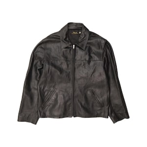 May include: A black leather jacket featuring a classic fold-down collar, a full-length front zipper closure, and two slanted welt pockets at the waist. The interior label displays the brand name Savron in gold lettering against a black background.