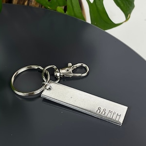 138 km/h Tillbaka till framtiden-nyckelring | Tillbaka till framtiden-present | Fluxkondensator | Tidsresor