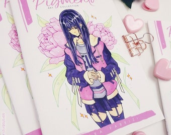 May include: A pink and white art book with the title "Pigmento Art Collection" and the name "Sara Fabrizi" on the cover. The cover features a drawing of a person with long black hair wearing a pink jacket and a black skirt. The person is standing in front of a pink flower.