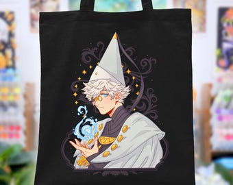 May include: A black tote bag featuring a graphic illustration of a character with white hair, wearing a pointed hat, a monocle, and a white cape with gold buttons. The character holds a glowing blue orb in their hand. The text shop.sarafabrizi.com is printed at the bottom.