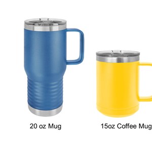 May include: Two stainless steel travel mugs with lids and handles. The mug on the left is blue and 20 oz. The mug on the right is yellow and 15 oz.