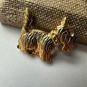 Gold Dog Brooch with Ice Colored Rhinestone Eyes Signed AAI Vintage Pin