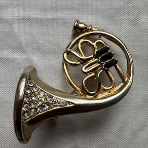 French Horn Brooch with Gold Toned Metal and Ice Colored Rhinestones