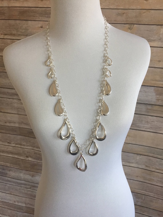 Silver Toned Metal with Dangling Tear Drop Pendant